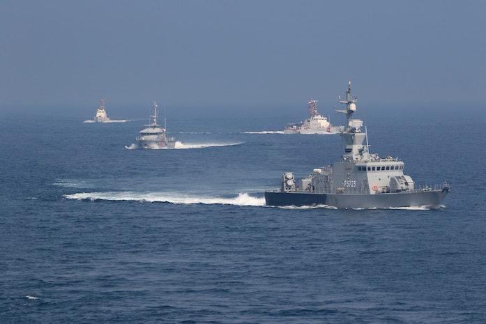 201105-N-N0146-1589 ARABIAN GULF (Nov. 05 2020) The guided-missile destroyer USS Ralph Johnson (DDG 114), Kuwait Naval Force missile boat Al- Saadi (P 3723), Kuwait Coast Guard fast patrol boat Marzoug (P 314) and U.S. Coast Guard patrol boats USCGC Aquidneck (WPB 1309) and USCGC Monomoy (WPB 1326) steam in formation during a joint maritime security patrol exercise in the Arabian Gulf, Nov. 5. Ralph Johnson is part of Nimitz Carrier Strike Group and is deployed to the U.S. 5th Fleet area of operations to ensure maritime stability and security in the Central Region, connecting the Mediterranean and Pacific through the Western Indian Ocean and three critical chokepoints to the free flow of global commerce.