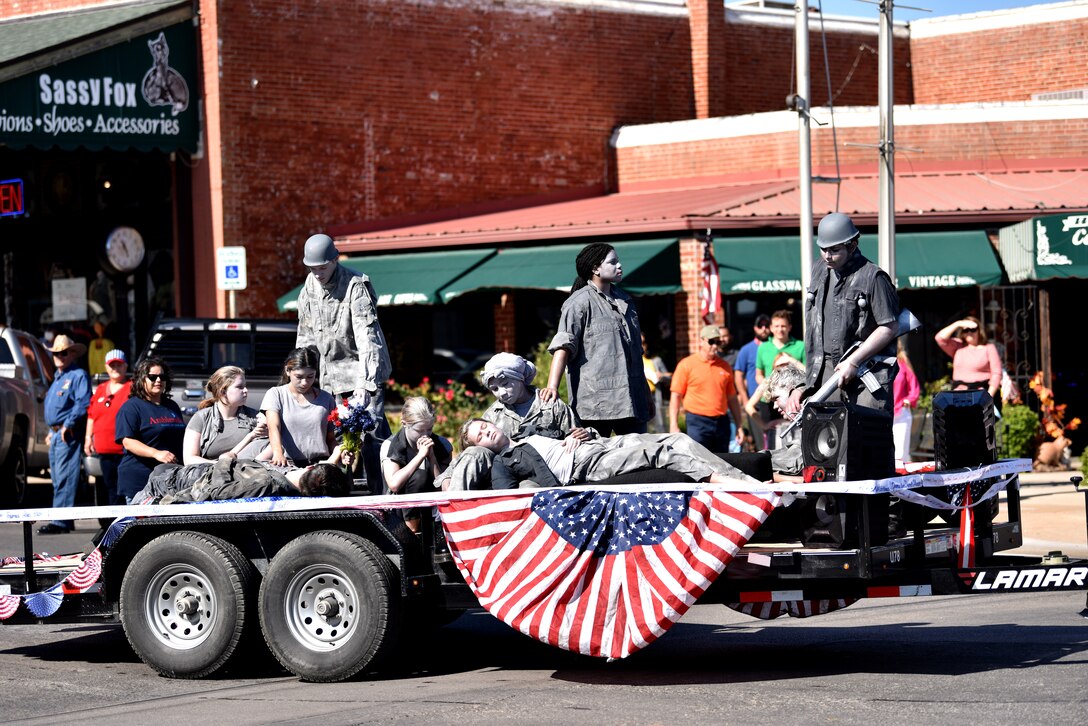 Students from a local school ride on a float during the Veterans Day Parade in downtown San Angelo, Texas, Nov. 7, 2020. The participants took first place for their float for the third year running. (U.S. Air Force photo by Staff Sgt. Seraiah Wolf)