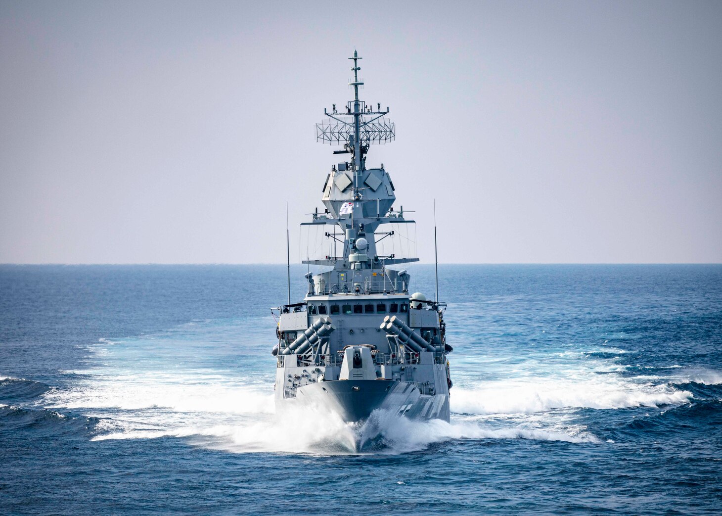 The Royal Australian Navy Anzac-class frigate HMAS Ballarat (FFH 155) sails in formation with the Arleigh Burke-class guided-missile destroyer USS John S. McCain (DDG 56) and the Takanami-class destroyer JS Oonami (JS 111) while conducting integrated operations. McCain is assigned to Destroyer Squadron Fifteen (DESRON 15), the Navy’s largest forward-deployed DESRON and the U.S. 7th Fleet’s principal surface force.