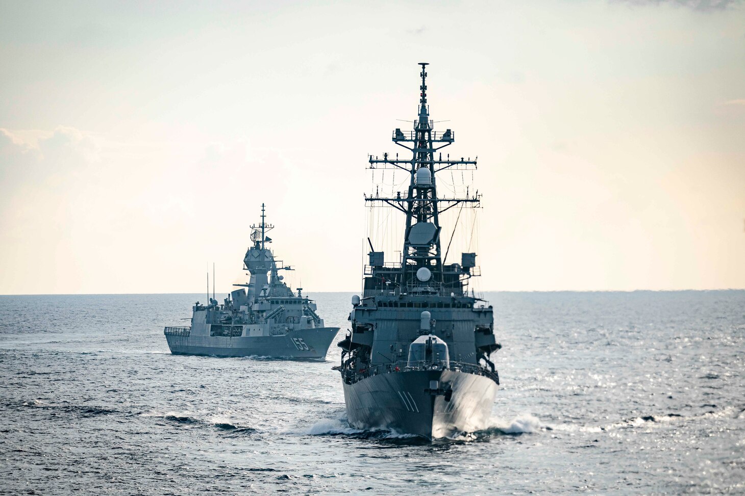 The Arleigh Burke-class guided-missile destroyer USS John S. McCain (DDG 56) performs divisional tactics with the Royal Australian Navy Anzac-class frigate HMAS Ballarat (FFH 155) and the Takanami-class destroyer JS Oonami (JS 111) while conducting integrated operations. McCain is assigned to Destroyer Squadron Fifteen (DESRON 15), the Navy’s largest forward-deployed DESRON and the U.S. 7th Fleet’s principal surface force.