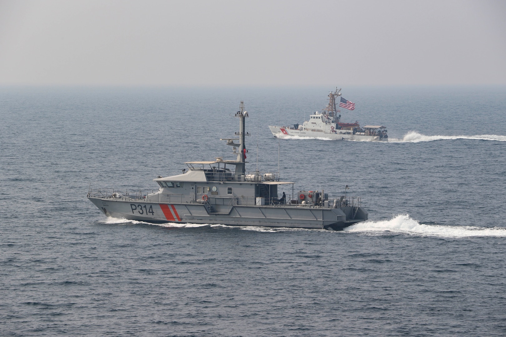 201105-N-N0146-1589 ARABIAN GULF (Nov. 05 2020) The guided-missile destroyer USS Ralph Johnson (DDG 114), Kuwait Naval Force missile boat Al- Saadi (P 3723), Kuwait Coast Guard fast patrol boat Marzoug (P 314) and U.S. Coast Guard patrol boats USCGC Aquidneck (WPB 1309) and USCGC Monomoy (WPB 1326) steam in formation during a joint maritime security patrol exercise in the Arabian Gulf, Nov. 5. Ralph Johnson is part of Nimitz Carrier Strike Group and is deployed to the U.S. 5th Fleet area of operations to ensure maritime stability and security in the Central Region, connecting the Mediterranean and Pacific through the Western Indian Ocean and three critical chokepoints to the free flow of global commerce.