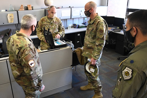 Senior Master Sgt. Mark Skarban, 302nd Operations Support Squadron superintendent, shows Col. Christopher Zidek, 302 AW commander and Chief Master Sgt. Kahn Scalise, 302 AW command chief, new equipment during a tour through several wing squadrons, Nov. 8, 2020, at Peterson-Schriever Garrison, Colorado. Zidek and Scalise went to several squadrons to meet with the reservists to see their mission and talk about their successes and challenges. (U.S. Air Force photo by Tech. Sgt. Tiffany Lundberg)