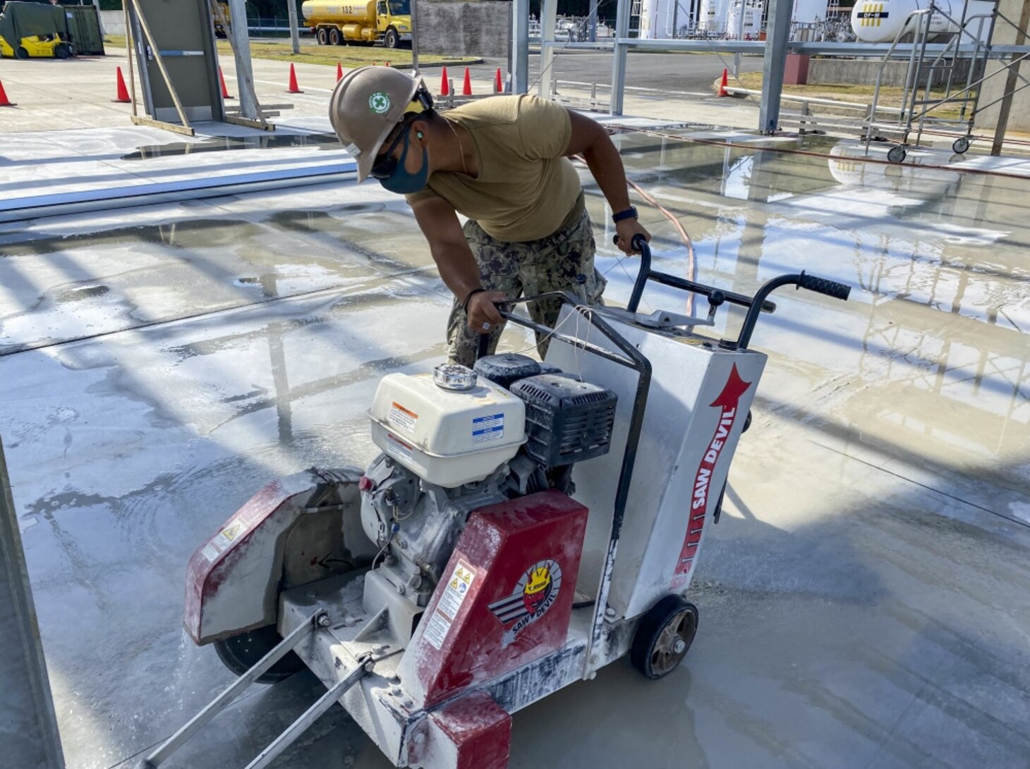 SASEBO, Japan (Oct. 29, 2020) Builder 3rd Class Johan Maldonadocorro, from Monterey, Calif., assigned to U.S. Naval Mobile Construction Battalion (NMCB) 3’s Detail Sasebo, cuts control joints in a concrete pad for the construction of a pre-engineered building that will serve as a warehouse for Naval Beach Unit 7. NMCB-3 is deployed across the Indo-Pacific region conducting high-quality construction to support U.S. and partner nations to strengthen partnerships, deter aggression, and enable expeditionary logistics and naval power projection. The battalion stands ready to support Major Combat Operations throughout the area of operations.