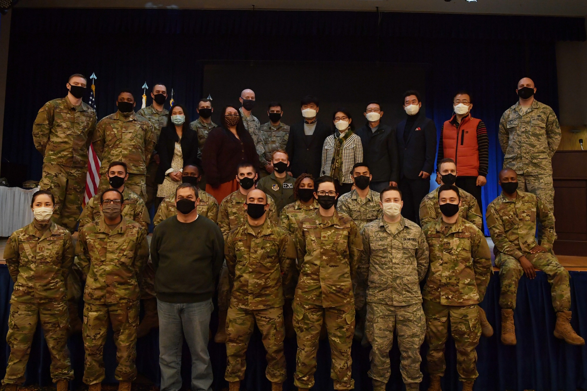 Members of the 18th Intelligence Squadron Detachment 2 pose for a group photo after a transfer ceremony at Osan Air Base, Republic of Korea, Nov. 5, 2020. The ceremony was held to mark the deactivation of the 18th and activation of the 73rd Intelligence, Surveillance and Reconnaissance Squadron detachment 2 as part of the U.S. Space Force. (U.S. Air Force photo by Senior Airman Noah Sudolcan)