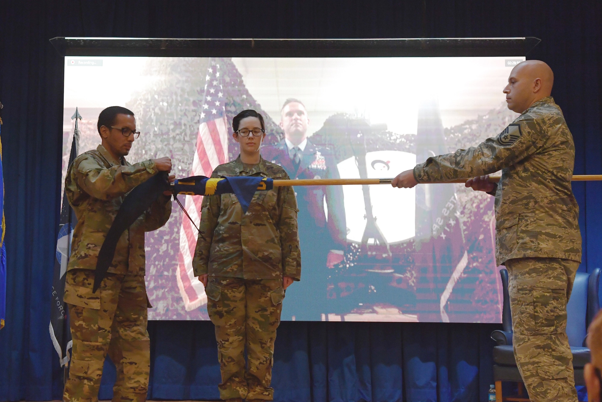 The 18th Intelligence Squadron Detachment 2 guidon furls during a transition ceremony at Osan Air Base, Republic of Korea, Nov. 5, 2020. The 18th IS rendered inactive as the unit transitioned into the U.S. Space Force’s 73rd ISRS. (U.S. Air Force photo by Senior Airman Noah Sudolcan)