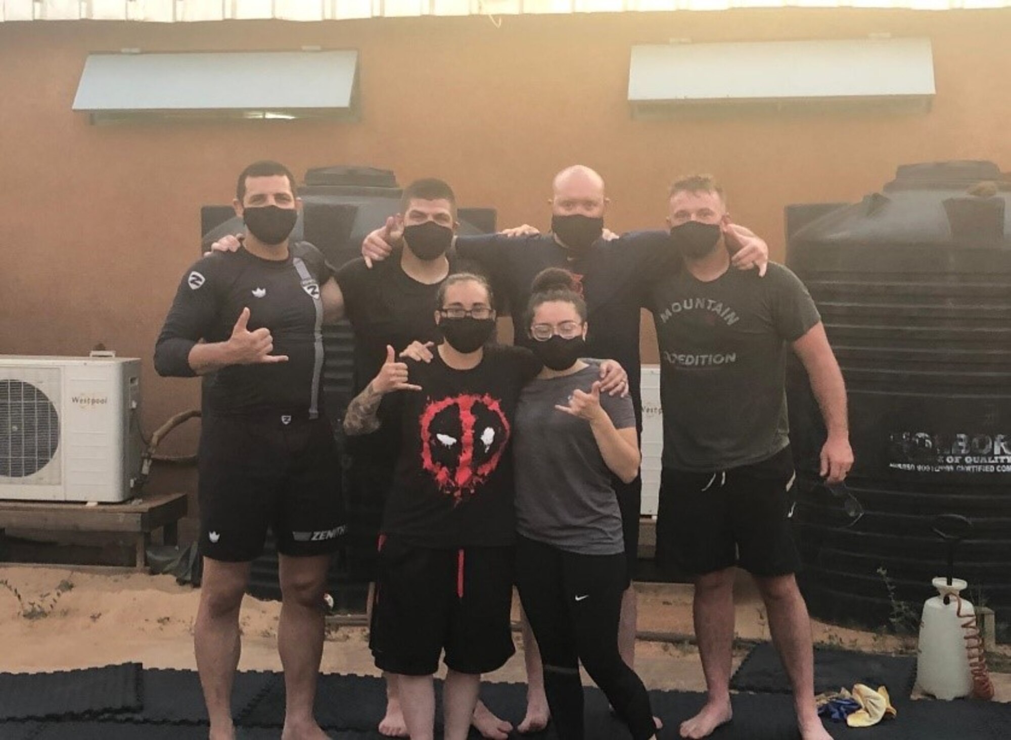 U.S. Air Force Senior Airman Marcio Navarro, 768th Expeditionary Air Base Squadron services technician, poses with Airmen that attended his Mixed Martial Arts lesson, at Nigerian Air Base 101, Niamey, Niger, Nov. 3, 2020.