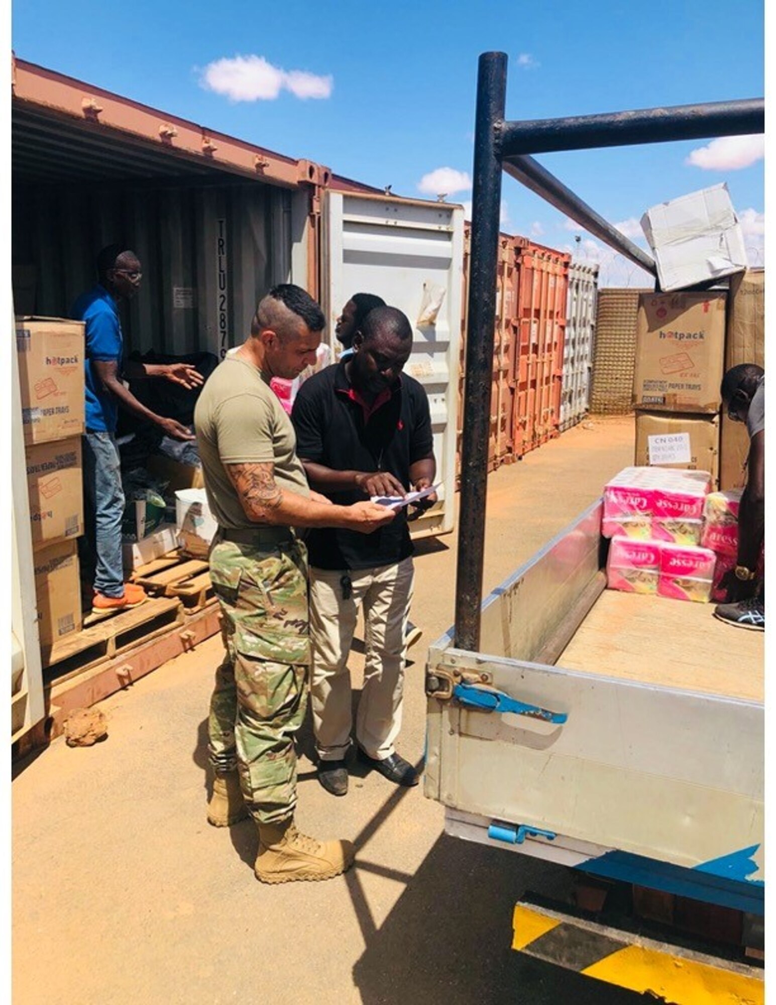 U.S. Air Force Senior Airman Marcio Navarro, 768th Expeditionary Air Base Squadron services technician, verifies an order before signing off an inventory list, at Nigerian Air Base 101, Niamey, Niger, Nov. 3, 2020.