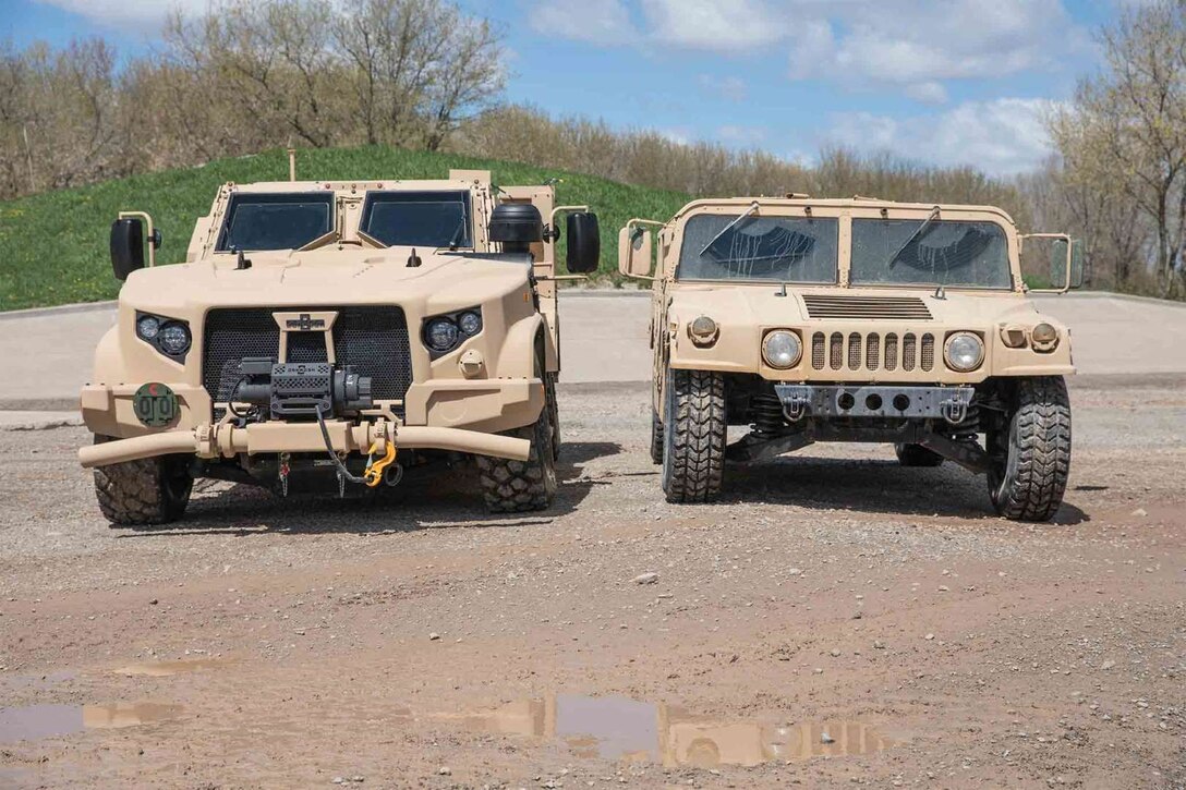 The Air Force Life Cycle Management Center's Agile Combat Support Directorate is working to replace the up-armored High Mobility Multipurpose Wheeled Vehicles, or Humvee (right), with the Joint Light Tactical Vehicles (left). (Courtesy Photo)
