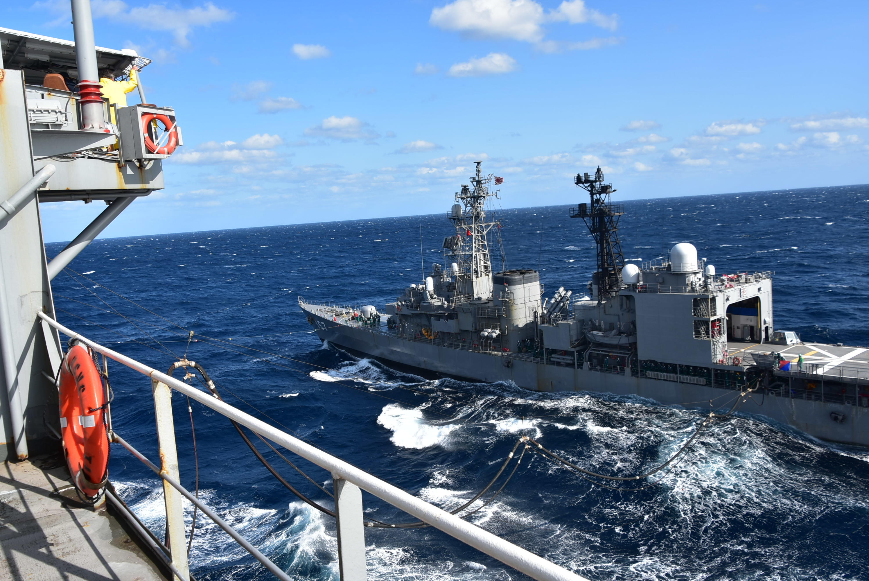 The Japan Maritime Self-Defense Force Asagiri-class destroyer JS Sawagiri (DD 157) receives fuel from the U.S. Navy Military Sealift Command Henry J. Kaiser-class fleet replenishment oiler USNS Tippecanoe (T-AO 199) during Keen Sword.