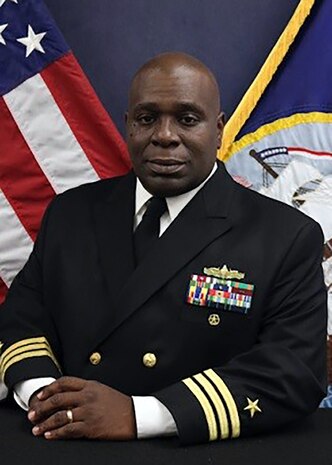 A studio photo of Cmdr. Corey Odom.