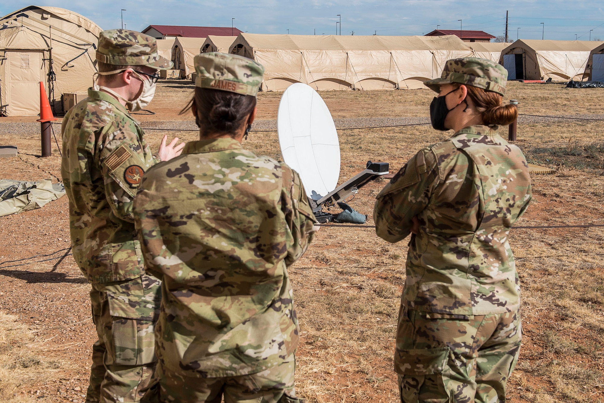 Members of the tactical local access network team show the current satellite being used for their training to Maj. Emily Short, 27th Special Operations Communications Squadron commander, at Cannon Air Force Base, N.M., Nov. 3, 2020. The TACLAN provided over 30 special tactics Airmen with network access to ensure that the teams could have full access to the necessary resources to ensure proper training. (U.S. Air Force photo by Senior Airman Vernon R. Walter III)