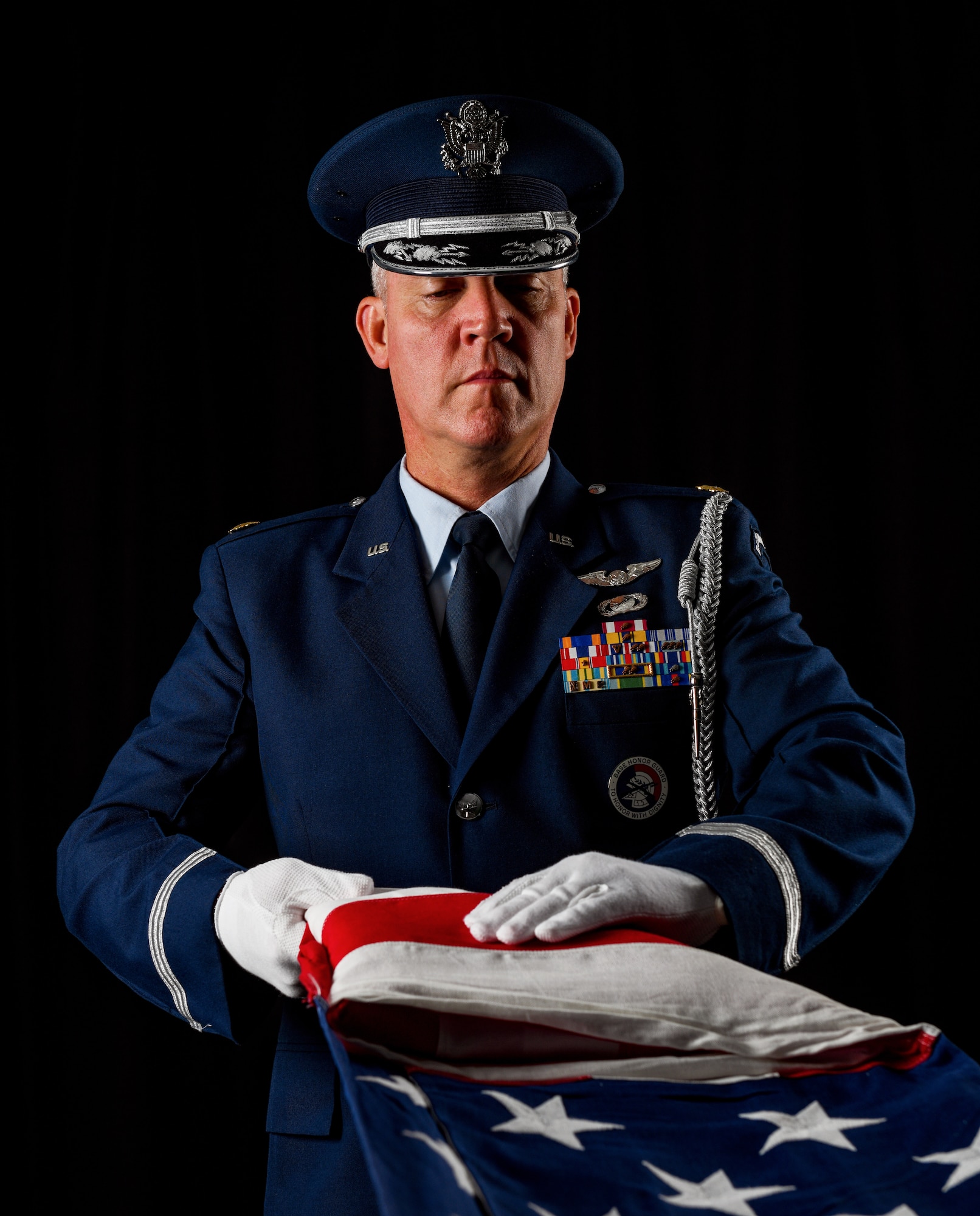 Maj. Scott Allen, 910th Airlift Wing public affairs officer, folds an American flag, Aug. 21, 2020, at Youngstown Air Reserve Station, Ohio.