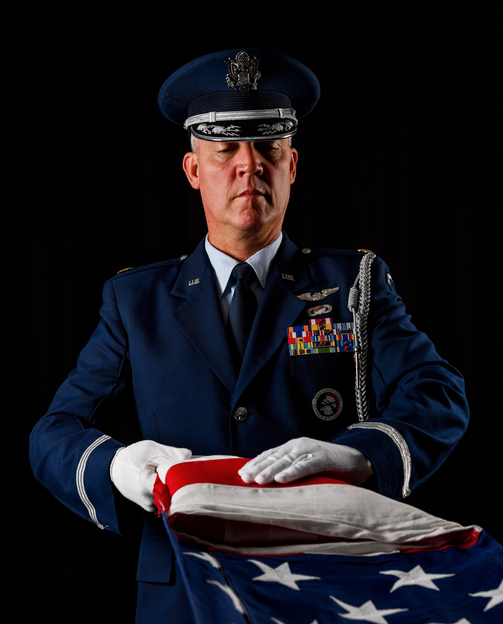 Maj. Scott Allen, 910th Airlift Wing public affairs officer, folds an American flag, Aug. 21, 2020, at Youngstown Air Reserve Station, Ohio.