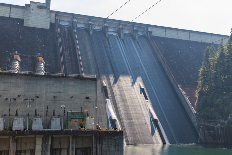 The U.S. Army Corps of Engineers is modifying operations at Detroit Dam to improve juvenile salmon downstream passage survival by releasing water exclusively through the upper regulating outlets when downstream passage rates are high. Water is running through the upper regulating outlets, as seen in this photo. (U.S. Army photo by Jeremy Bell)