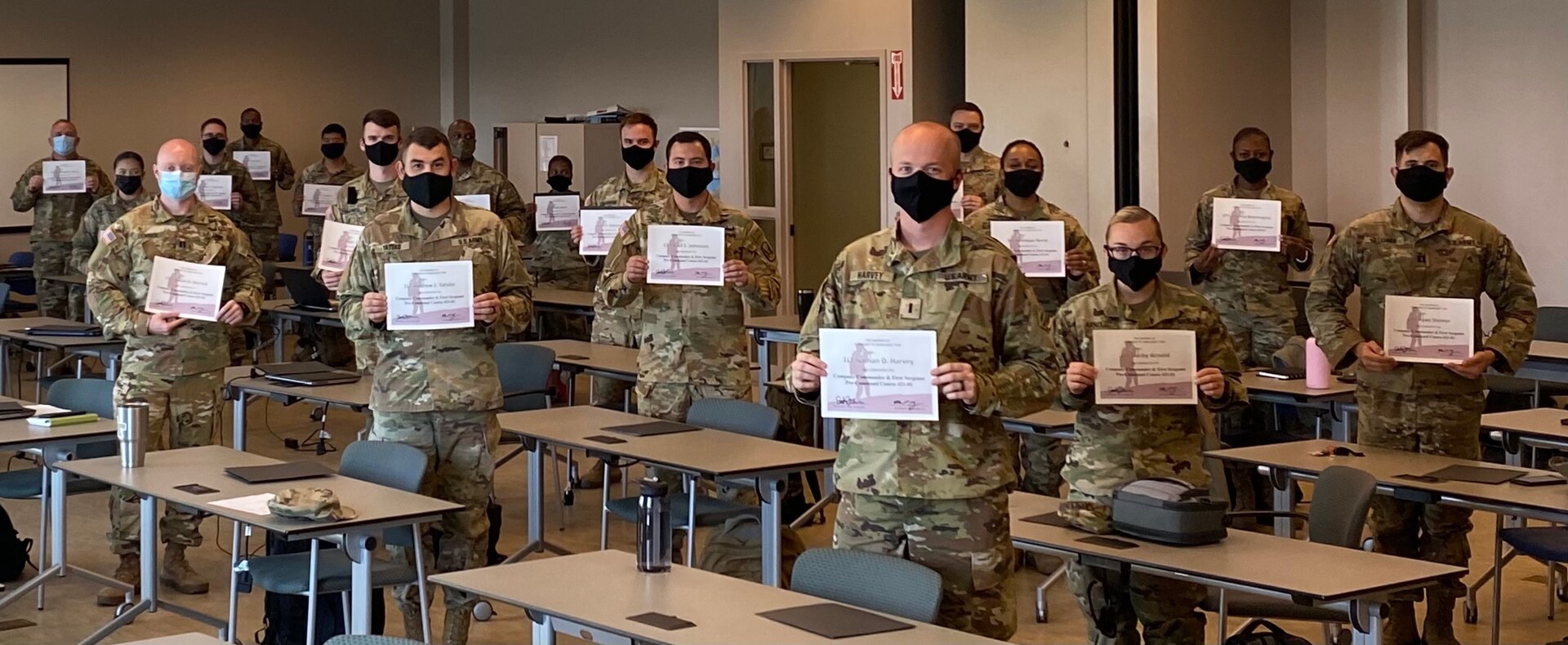 U.S. Army officers and noncommissioned officers from the Georgia Army National Guard proudly show their diplomas after graduating from Company Command Pre-Command Course at Clay National Guard Center in Marietta, Georgia, Oct. 30, 2020. The five-day leadership course trained company command teams on systems and services to effectively lead their formations.