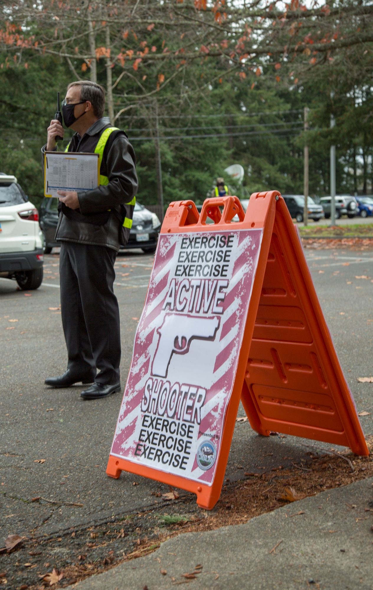 Mark Mclean, exercise program manager with 446th Inspector General for Inspections, communicates with other inspectors during an active shooter exercise Nov. 7, 2020, at Joint Base Lewis-McChord, Washington.