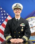 A studio portrait of Cmdr. Wolfe