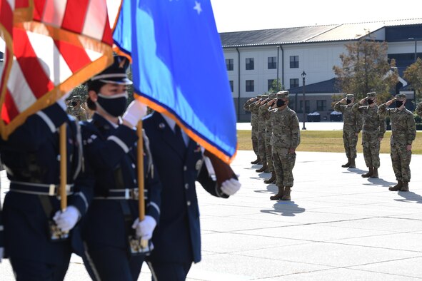 The Keesler Honor Guard marches off of the Levitow Training Support Facility drill pad during the final basic military training graduation ceremony at Keesler Air Force Base, Mississippi, Nov. 6, 2020. Nearly 60 trainees from the 37th Training Wing Detachment 5 completed the six-week BMT course. Throughout the duration of BMT training at Keesler, 18 flights and 939 Airmen graduated. (U.S. Air Force photo by Kemberly Groue)
