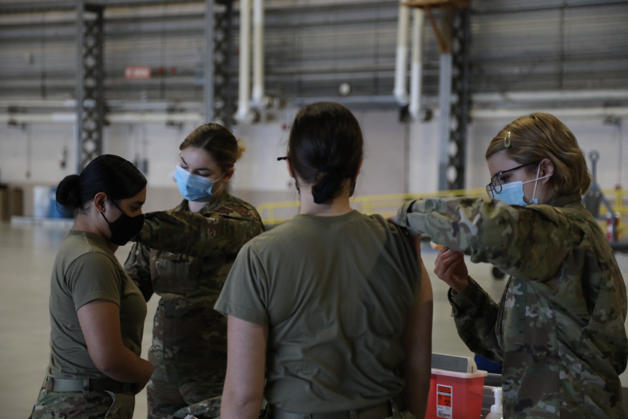 Aerospace medical technicians with the 446th Aeromedical Staging Squadron here, administer flu shot vaccines to 446th Airlift Wing Reserve Citizen Airmen Nov. 8, 2020.