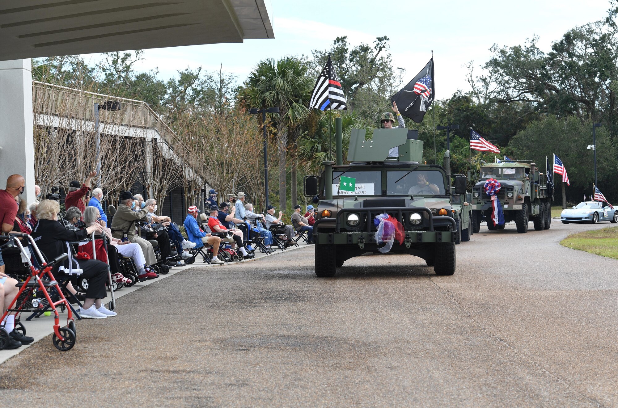 U.S. Air Force Maj. Gen. Craig Wills, Nineteenth Air Force commander, Joint Base San Antonio-Randolph, Texas, rides in the Gulf Coast Veteran's Day Roll-Thru and Wave Parade outside the Armed Forces Retirement Home at Gulfport, Mississippi, Nov. 7, 2020. Keesler Air Force Base leadership also participated in the parade in support of all veterans past and present. (U.S. Air Force photo by Kemberly Groue)