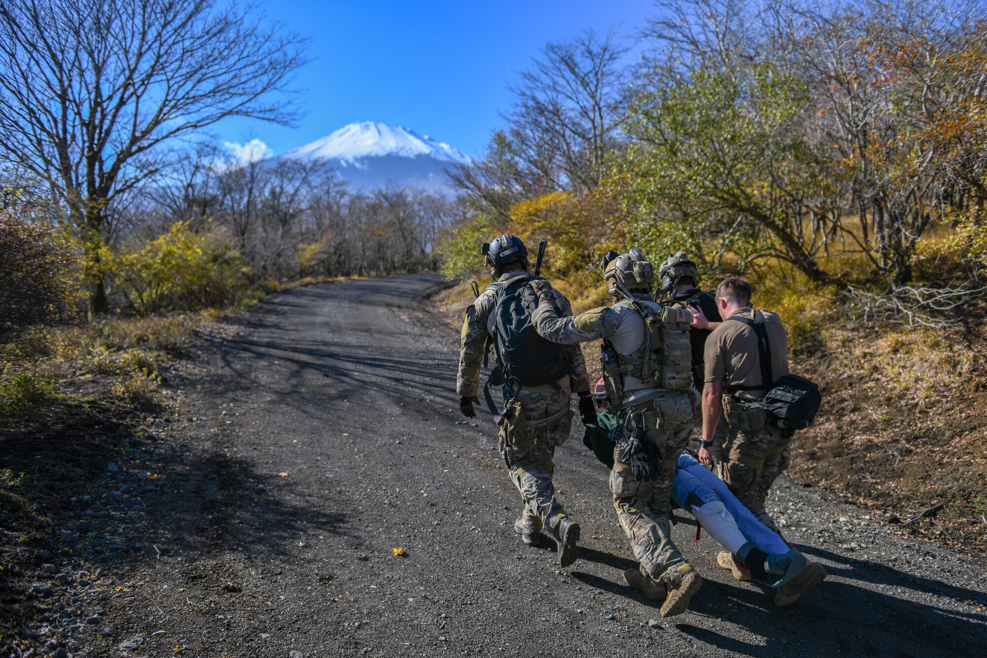 Operators carry a simulated victim to a rally point.