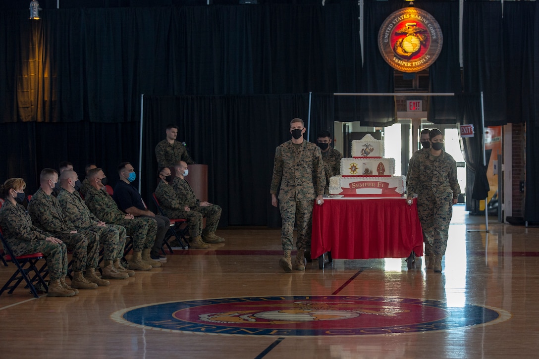 U.S. Marines march out the 245th Marine Corps birthday cake at the Goettge Memorial Field House on MCB Camp Lejeune, N.C., Nov. 5.