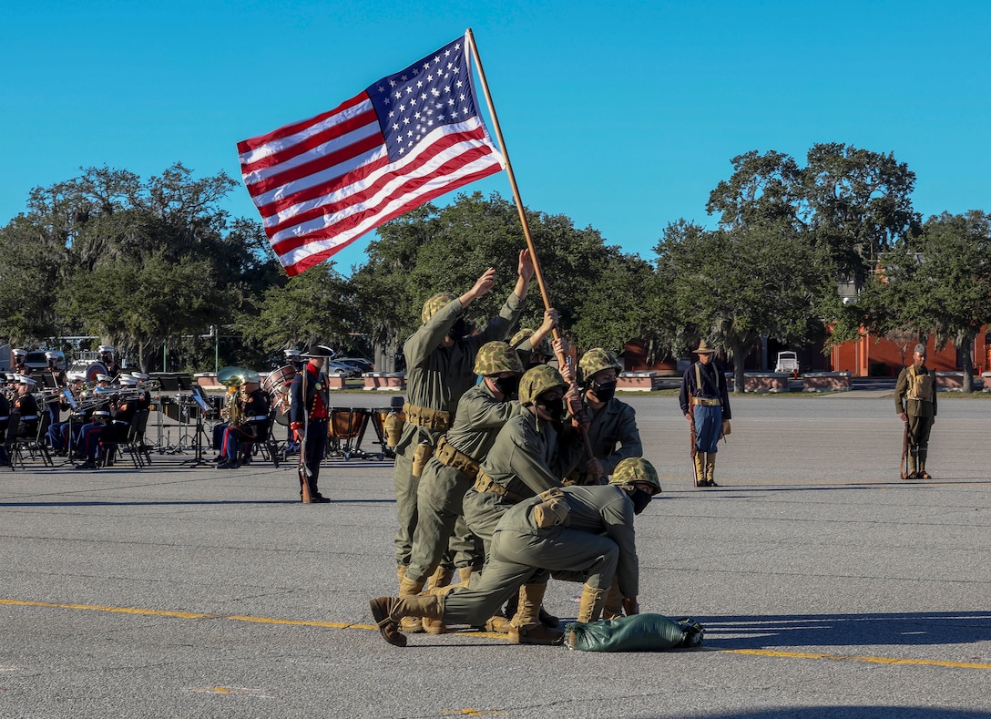 U.S. Marines and Sailors reenact the flag raising from the battle of Iwo Jima Marine during the MCRDPI birthday pageant at the Peatross Parade Deck aboard MCRDPI, S.C., Nov. 4.