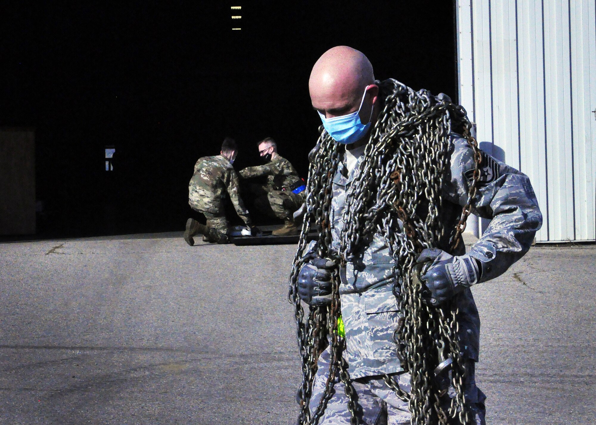Tech. Sgt. John Hardisky, 87th Aerial Port Squadron cargo processing supervisor, hauls cargo chains across a competition course during the 87th Aerial Port Squadron’s semi-annual Port Dawg Challenge Oct. 17, 2020. Port Dawgs rely on chains to secure a variety of cargo types for military airlift.