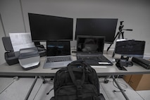 a group of computer equipment sits on a table.