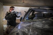 An EXU-1 deploying team member conducts scene documentation during one of the final certification events in late October at NSWC Indian Head Division. The FEP is the culmination of six months of training for EXU-1 personnel certifying them as ready to accomplish their critical mission in expeditionary technical intelligence operations.