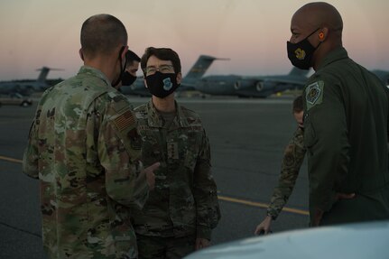 Gen. Jacqueline Van Ovost, center, Air Mobility Command commander, talks to Col. Marc Greene, left, 628th Air Base Wing commander, and Col. Jaron Roux, right, 437th Airlift Wing commander, after arriving to Joint Base Charleston, S.C., Nov. 2, 2020. Van Ovost, her husband Alan Frosch, and Chief Master Sgt. Brian Kruzelnick, AMC command chief, visited members of Joint Base Charleston as part of their listening tour. Their trip centered on meeting members of Team Charleston, highlighting their accomplishments and learning about their specific mission sets.