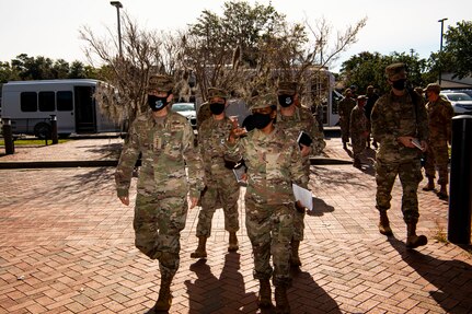 Gen. Jacqueline Van Ovost, Air Mobility Command commander, walks to the 628th Medical Group for a mission brief, Nov. 3, 2020, at Joint Base Charleston, S.C. Van Ovost, her husband Alan Frosch, and Chief Master Sgt. Brian Kruzelnick, AMC command chief, visited members of Joint Base Charleston as part of their listening tour. Their trip centered on meeting members of Team Charleston, highlighting their accomplishments and learning about their specific mission sets.