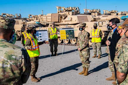 Gen. Jacqueline Van Ovost, Air Mobility Command commander, listens to a briefing from the 841st Transportation Battalion, Nov. 4, 2020, at Joint Base Charleston, S.C. Van Ovost, her husband Alan Frosch, and Chief Master Sgt. Brian Kruzelnick, AMC command chief, visited members of Joint Base Charleston as part of their listening tour. Their trip centered on meeting members of Team Charleston, highlighting their accomplishments and learning about their specific mission sets.