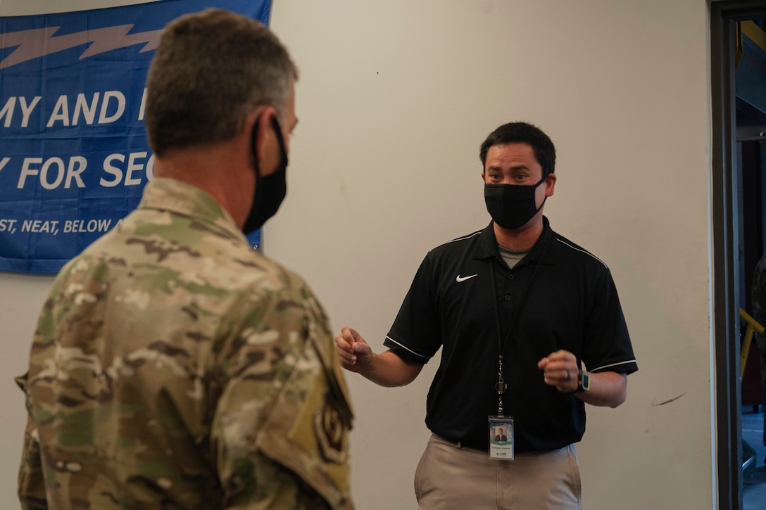 Photo of Maj. Gen. Franks speaking to an athletic trainer