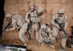 Three New York Army National Guard Soldiers served as the models for the figures in this display in the National Museum of the United States Army at Fort Belvoir, Virginia. Maj. Robert Freed posed for the figure holding the radio, Maj. (Chaplain) James Kim was the model for the crouching figure, and Sgt. 1st Class Jonathan Morrison was the model for the rifleman at the right of the tableau.