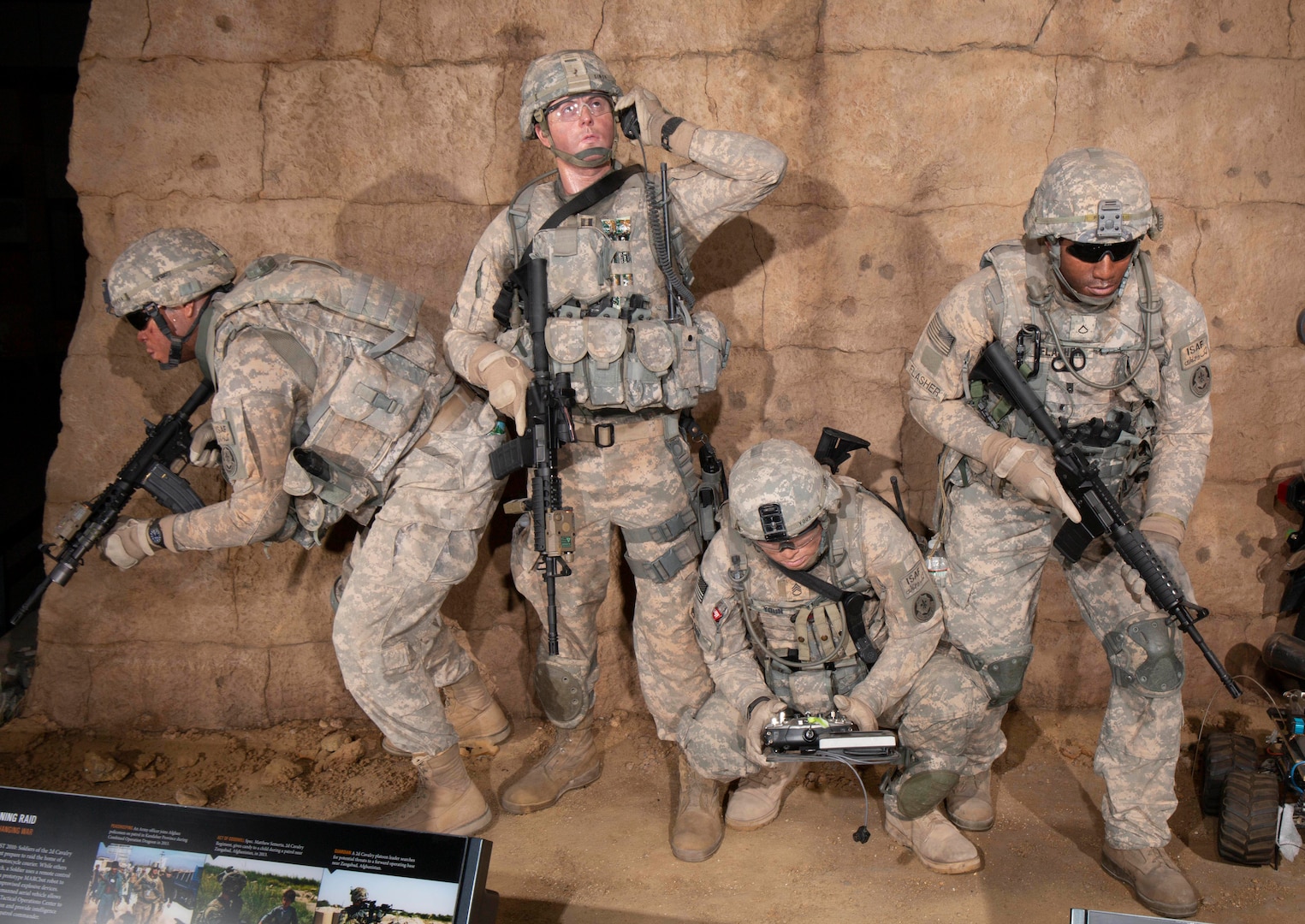 Three New York Army National Guard Soldiers served as the models for the figures in this display in the National Museum of the United States Army at Fort Belvoir, Virginia. Maj. Robert Freed posed for the figure holding the radio, Maj. (Chaplain) James Kim was the model for the crouching figure, and Sgt. 1st Class Jonathan Morrison was the model for the rifleman at the right of the tableau.