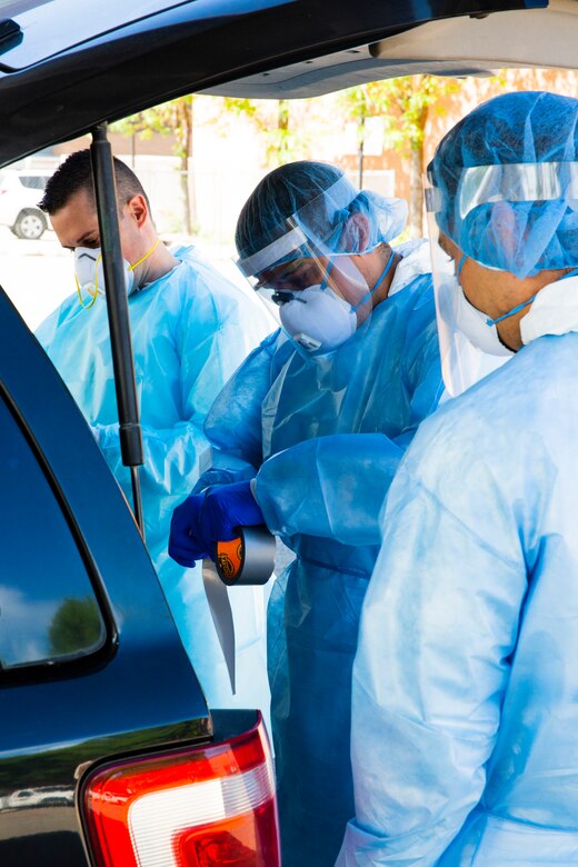 Utah National Guard Mobile Testing Team member wearing protective gear to conduct nasopharyngeal sample collection on Soldiers and civilians in Salt Lake City to check if they are a carrier of the novel coronavirus, COVID-19, May 27, 2020.