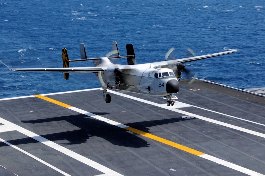 A C-2A Greyhound lands aboard the aircraft carrier USS Nimitz.