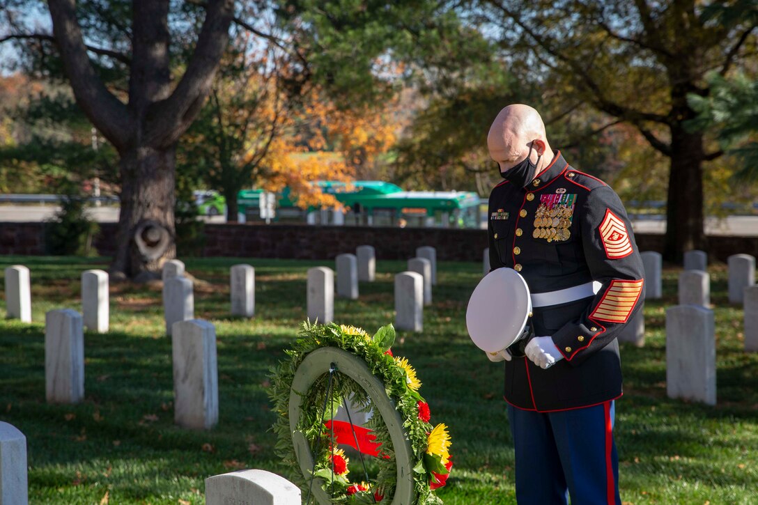 The 19th Sergeant Major of the Marine Corps, Sgt. Maj. Troy E. Black and the Marine Barracks Washington Sergeant Major, Sgt. Maj. Adrian Tagliere, pay tribute to Sgt. Maj. Gilbert Johnson at the Arlington National Cemetery following the Marine Corps Birthday Wreath Laying Ceremony, Arlington Va., Nov. 10, 2020. Johnson was one of the first African Americans to enlist in the United States Marine Corps. The ceremony is an annual event held at the Marine Corps War Memorial to honor the Corps’ birthday. (U.S. Marine Corps photo by Sgt. Victoria Ross)