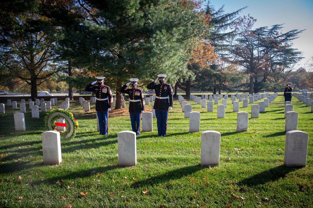 The 19th Sergeant Major of the Marine Corps, Sgt. Maj. Troy E. Black and the Marine Barracks Washington Sergeant Major, Sgt. Maj. Adrian Tagliere, pay tribute to Sgt. Maj. Gilbert Johnson at the Arlington National Cemetery following the Marine Corps Birthday Wreath Laying Ceremony, Arlington Va., Nov. 10, 2020. Johnson was one of the first African Americans to enlist in the United States Marine Corps. The ceremony is an annual event held at the Marine Corps War Memorial to honor the Corps’ birthday. (U.S. Marine Corps photo by Sgt. Victoria Ross)