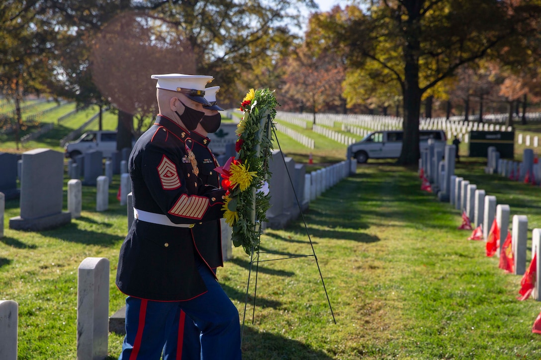 The 19th Sergeant Major of the Marine Corps, Sgt. Maj. Troy E. Black and the Marine Barracks Washington Sergeant Major, Sgt. Maj. Adrian Tagliere, pay tribute to Sgt. Benjamin Moffatt at the Arlington National Cemetery following the Marine Corps Birthday Wreath Laying Ceremony, Arlington Va., Nov. 10, 2020. Moffatt was chosen in honor of the 75th anniversary of World War II. Moffatt was one of the last enlisted killed in action during the war. (U.S. Marine Corps photo by Sgt. Victoria Ross)