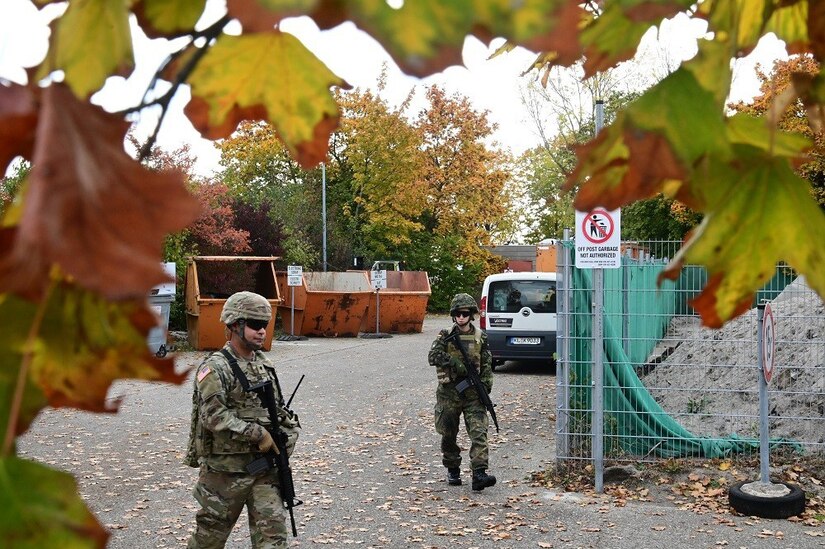 Two soldiers patrol during an exercise.