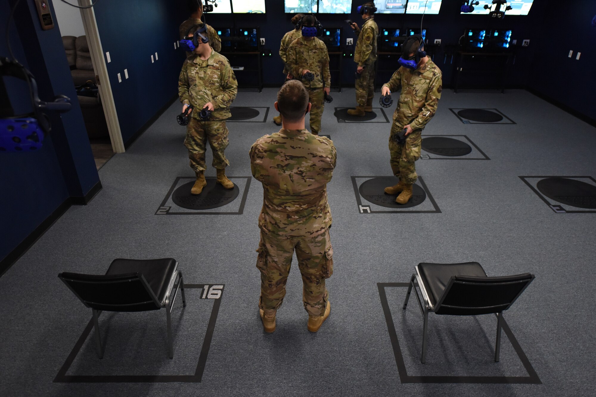 Air Force sergeant monitors virtual reality training session