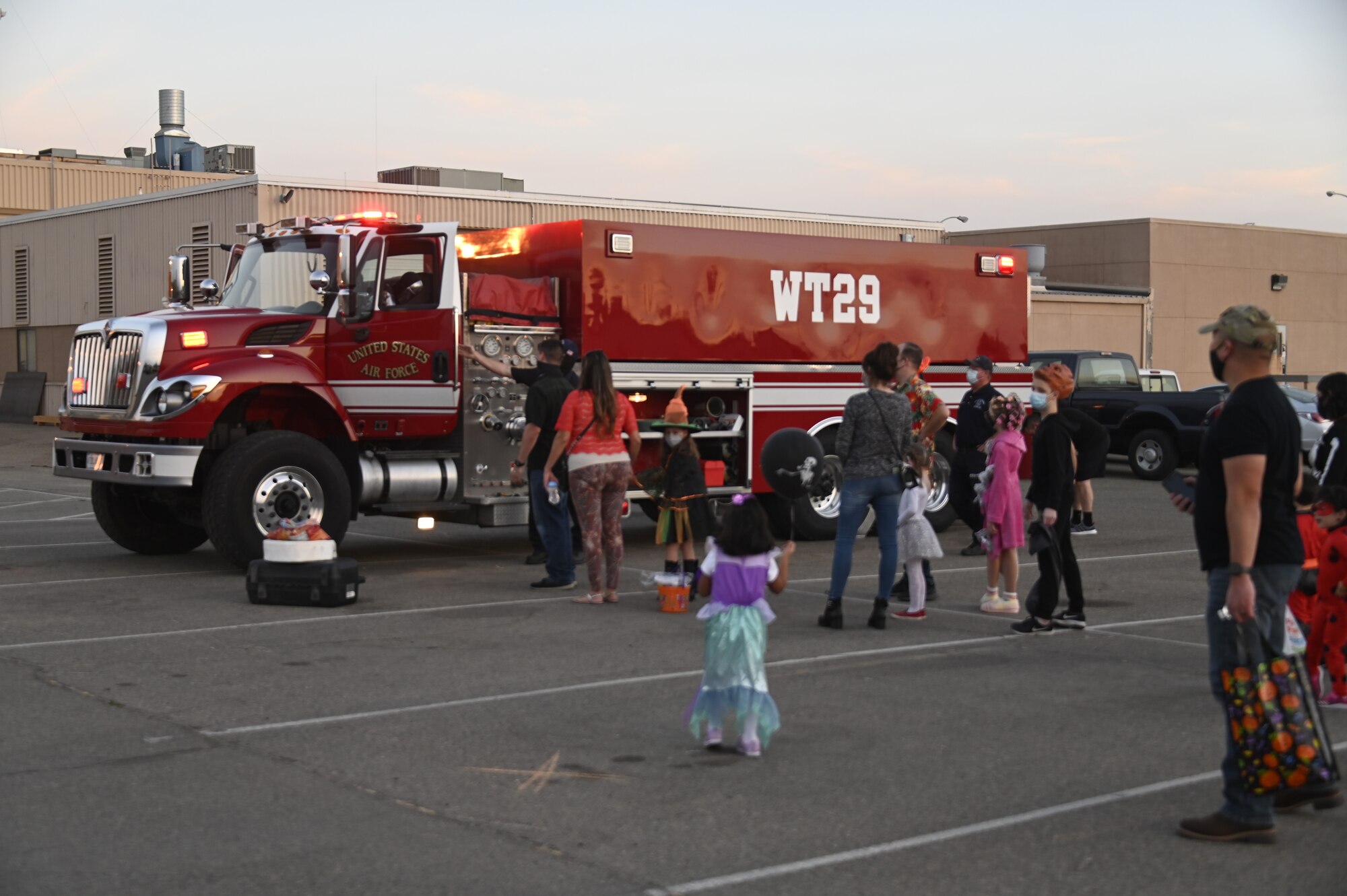 Airmen of the 144th Fighter Wing and their families attend a trunk-or-treat hosted at the Fresno Air National Guard base Oct. 23.
