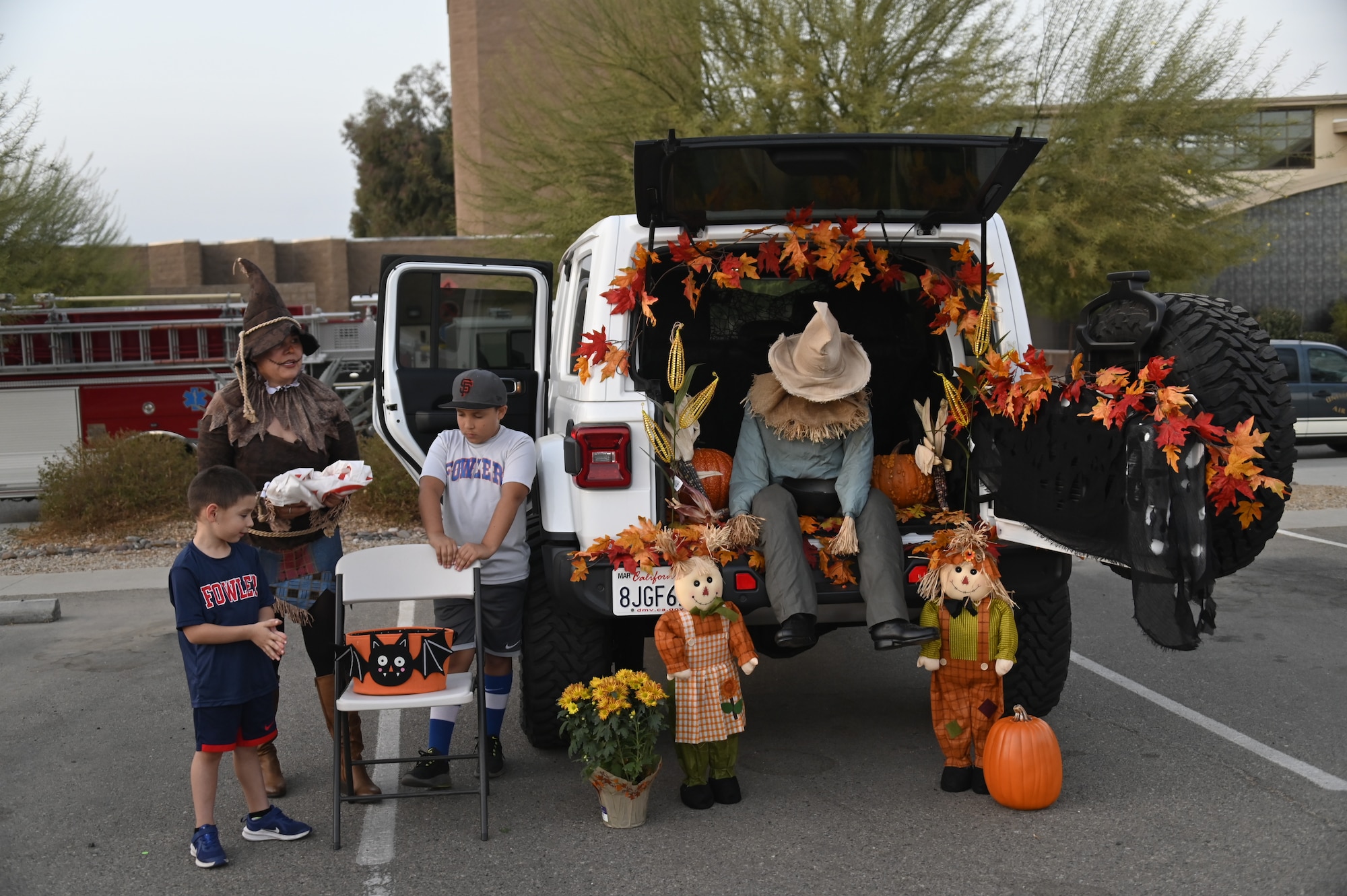 Airmen of the 144th Fighter Wing and their families attend a trunk-or-treat hosted at the Fresno Air National Guard base Oct. 23.
