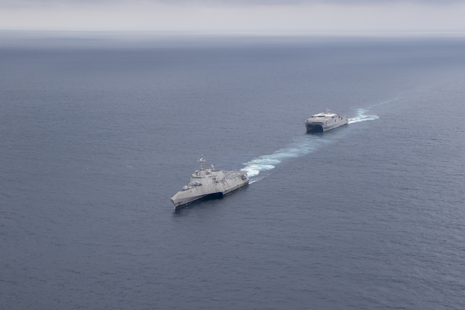 The Independence-class littoral combat ship USS Gabrielle Giffords (LCS 10) and the Spearhead-class expeditionary fast transport vessel USNS Burlington (T-EPF-10) conduct naval formations during a training exercise for UNITAS LXI off the coast of Manta, Ecuador, Nov. 7, 2020.