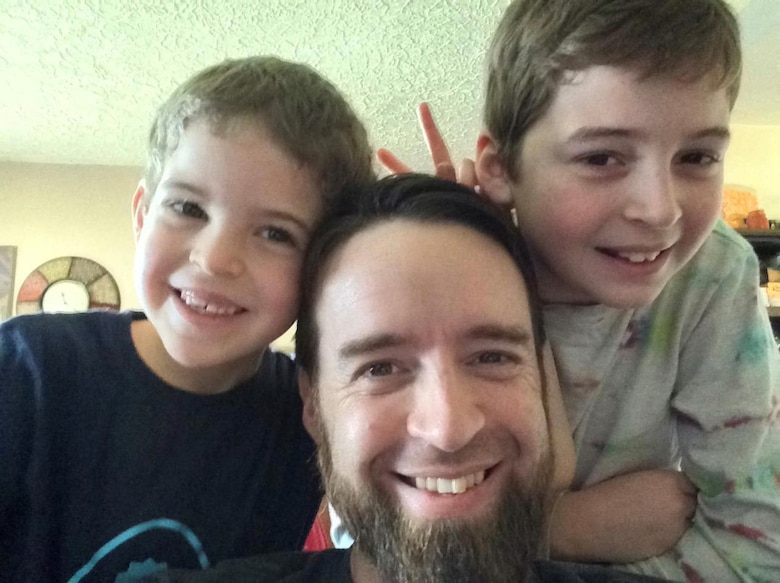 Anthony Johnson, technical writer-editor (engineering) with the U.S. Army Corps of Engineers' Portland District, in 2010 with his two sons, Ebin (far left), currently 12, and Ethan (far right), currently 16.