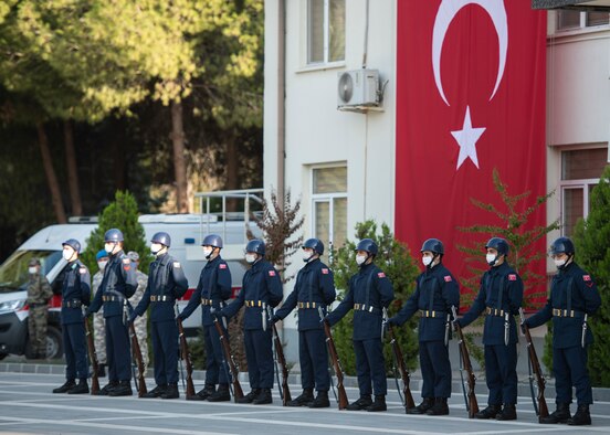 TurAF personnel stand in formation during a ceremony.