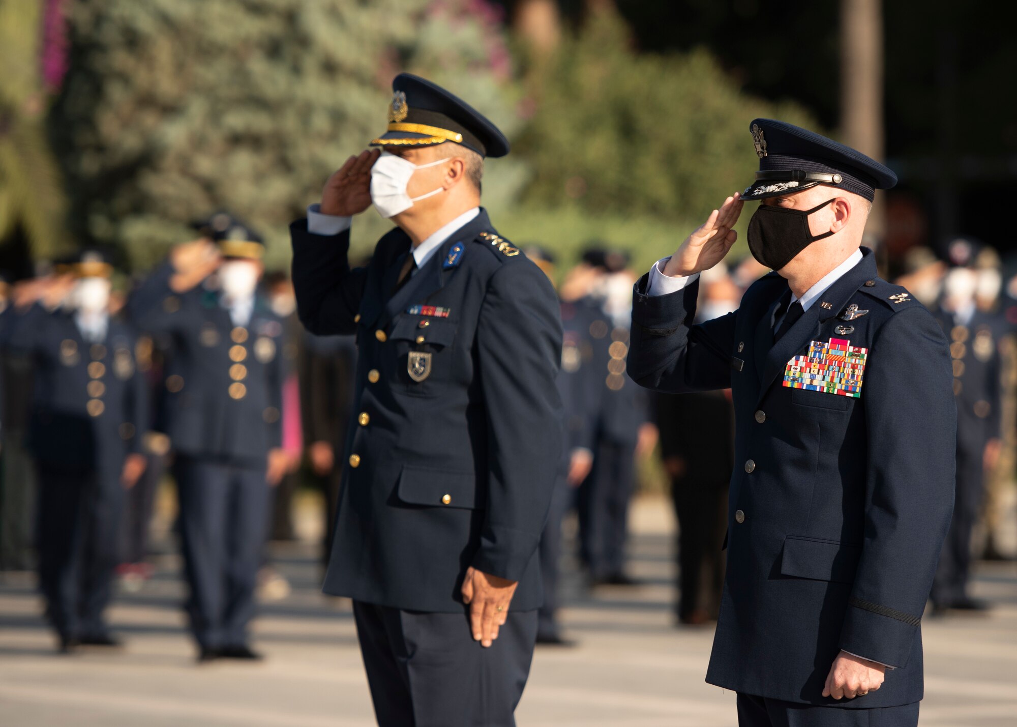 10th Tanker Base commander and 39th Air Base Wing commander render a salute during a ceremony.