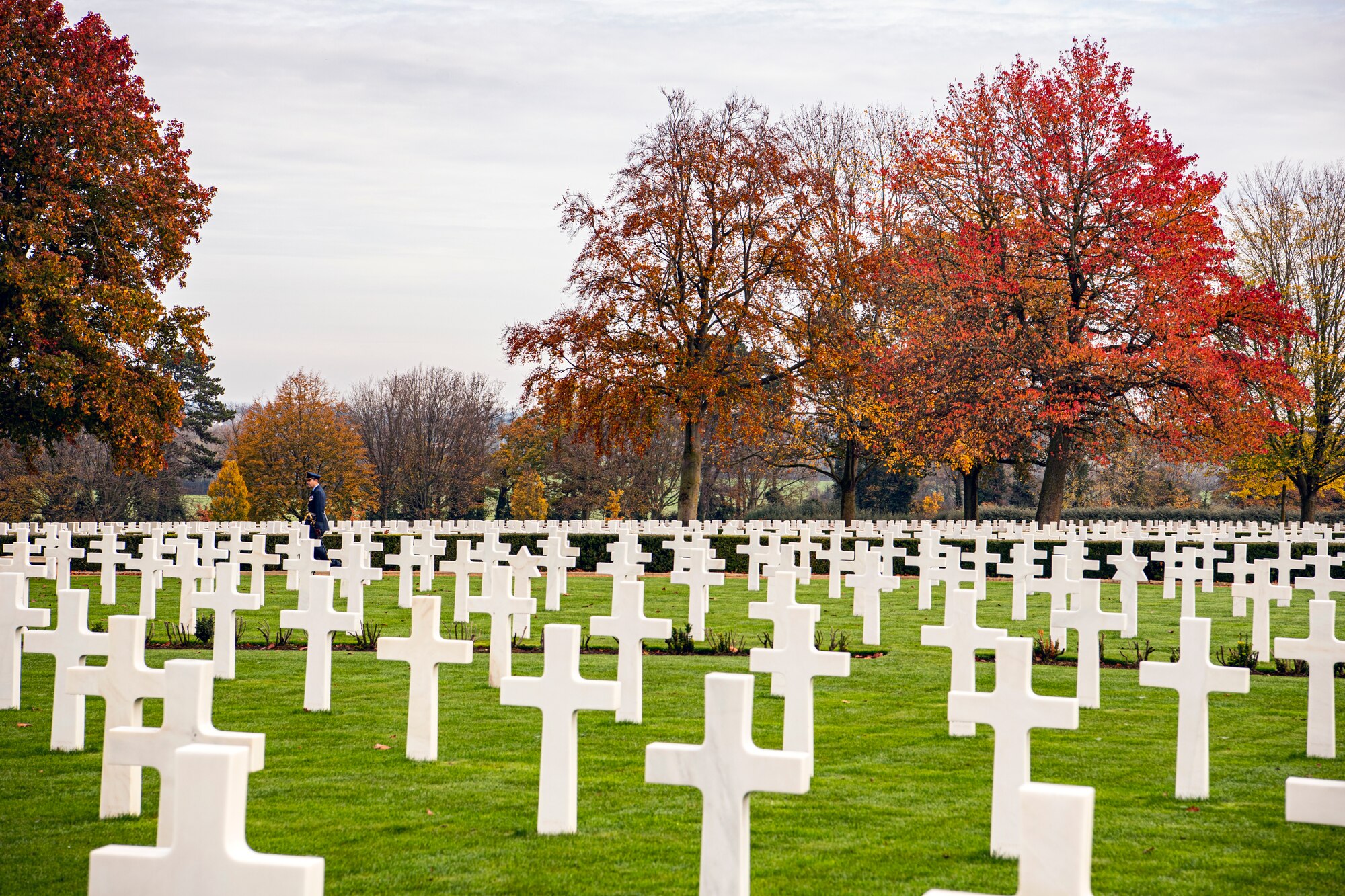 Royal Air Force Group Captain Phil Arnold, RAF High Wycombe commander, observes the headstones at Cambridge American Cemetery and Memorial, England, Nov. 9, 2020. Laid to rest at the cemetery are 3,812 United States service members killed during World War II. (U.S Air Force photo by Senior Airman Eugene Oliver)